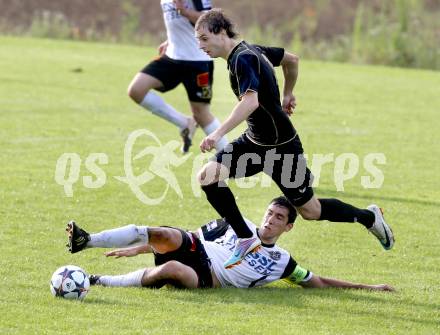 Fussball Kaerntner Liga. Koettmannsdorf gegen SV Spittal. Christian Schimmel, (Koettmannsdorf),  Rafael Graf (Spittal). Koettmannsdorf, am 27.7.2014.
Foto: Kuess
---
pressefotos, pressefotografie, kuess, qs, qspictures, sport, bild, bilder, bilddatenbank