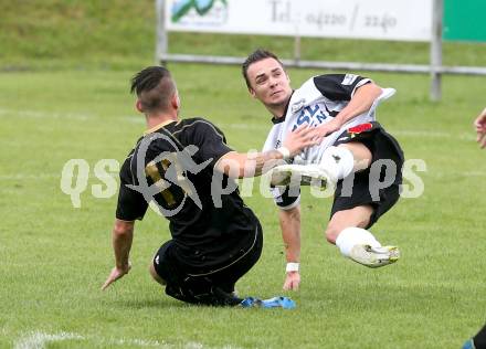 Fussball Kaerntner Liga. Koettmannsdorf gegen SV Spittal. Guenther Hubmann, (Koettmannsdorf), Matic Sever (Spittal). Koettmannsdorf, am 27.7.2014.
Foto: Kuess
---
pressefotos, pressefotografie, kuess, qs, qspictures, sport, bild, bilder, bilddatenbank