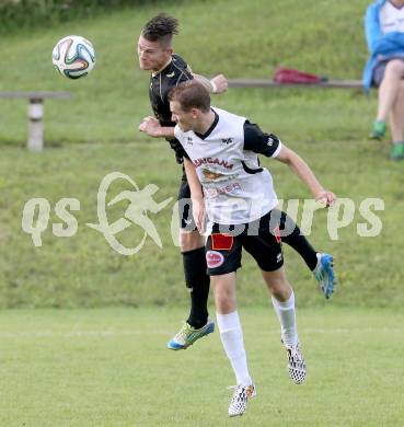 Fussball Kaerntner Liga. Koettmannsdorf gegen SV Spittal. Guenther Hubmann,  (Koettmannsdorf), Daniel Urbas (Spittal). Koettmannsdorf, am 27.7.2014.
Foto: Kuess
---
pressefotos, pressefotografie, kuess, qs, qspictures, sport, bild, bilder, bilddatenbank