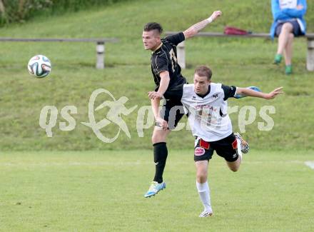 Fussball Kaerntner Liga. Koettmannsdorf gegen SV Spittal. Guenther Hubmann,  (Koettmannsdorf), Daniel Urbas (Spittal). Koettmannsdorf, am 27.7.2014.
Foto: Kuess
---
pressefotos, pressefotografie, kuess, qs, qspictures, sport, bild, bilder, bilddatenbank