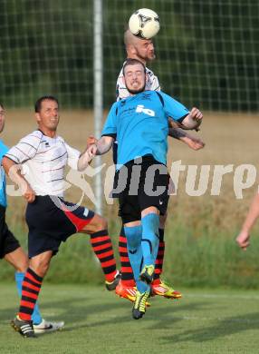 Fussball. Unterliga Ost. SG Magdalensberg/Eberndorfer AC gegen SPG FC Poggersdorf KM. Danijel Josimovic,  (Magdalensberg), Michael Miklautz (Poggersdorf). Pischeldorf, am 26.7.2014.
Foto: Kuess
---
pressefotos, pressefotografie, kuess, qs, qspictures, sport, bild, bilder, bilddatenbank