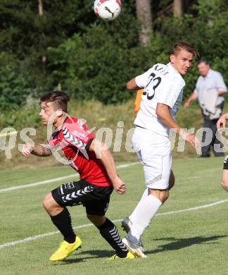 Fussball. Kaerntner Liga. Atus Ferlach gegen SV Feldkirchen/SV Oberglan. Dejan Kern (Ferlach), Philipp Wisotzky (SV Feldkirchen/SV Oberglan). Ferlach, 2.8.2014.
Foto: Kuess
---
pressefotos, pressefotografie, kuess, qs, qspictures, sport, bild, bilder, bilddatenbank