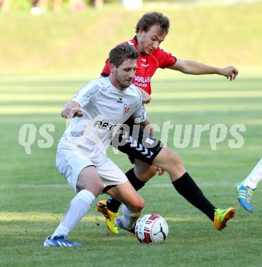 Fussball. Kaerntner Liga. Atus Ferlach gegen SV Feldkirchen/SV Oberglan. Markus Dixer (Ferlach), Sandro Struckl (SV Feldkirchen/SV Oberglan). Ferlach, 2.8.2014.
Foto: Kuess
---
pressefotos, pressefotografie, kuess, qs, qspictures, sport, bild, bilder, bilddatenbank