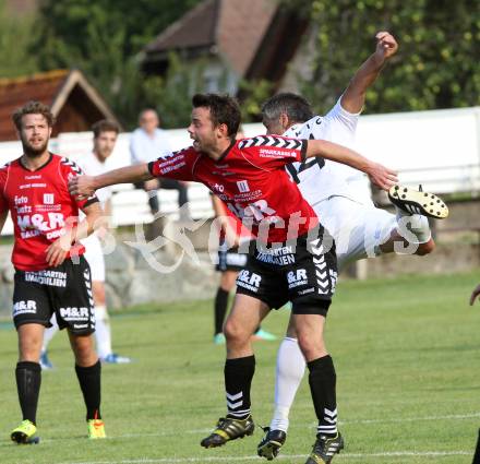 Fussball. Kaerntner Liga. Atus Ferlach gegen SV Feldkirchen/SV Oberglan. Darko Djukic (Ferlach), Patrick Rene Striednig (SV Feldkirchen/SV Oberglan). Ferlach, 2.8.2014.
Foto: Kuess
---
pressefotos, pressefotografie, kuess, qs, qspictures, sport, bild, bilder, bilddatenbank