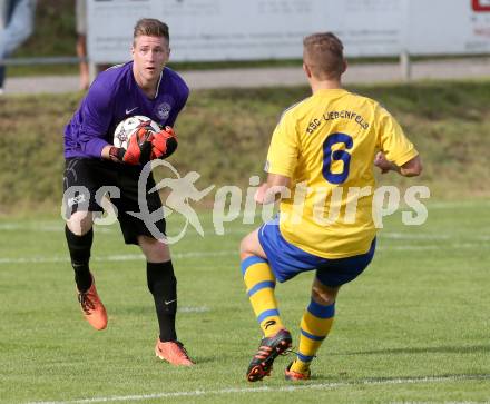 Fussball Unterliga Ost. Ludmannsdorf gegen Liebenfels. Juergen Zedlacher,  (Ludmannsdorf), Martin Hinteregger (Liebenfels). Ludmannsdorf, 3.8.2014.
Foto: Kuess
---
pressefotos, pressefotografie, kuess, qs, qspictures, sport, bild, bilder, bilddatenbank