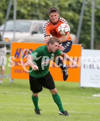 Fussball 2. KLasse C. Oberglan gegen St. Urban. Alexander Zaiser, (Oberglan),   Philipp Kandut (St. Urban). Oberglan, am 16.8.2014.
Foto: Kuess
---
pressefotos, pressefotografie, kuess, qs, qspictures, sport, bild, bilder, bilddatenbank