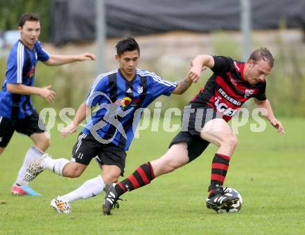 Fussball 2. KLasse D. Tainach gegen St. Paul. Johannes Schiffer,  (Tainach), Martin Alexander Lippitz (St. Paul). Tainach, am 23.8.2014.
Foto: Kuess
---
pressefotos, pressefotografie, kuess, qs, qspictures, sport, bild, bilder, bilddatenbank