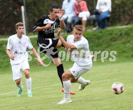 Fussball. Kaerntner Liga. Atus Ferlach gegen Spittal/Drau. Dejan Kern (Ferlach), Enes Brdjanovic (Spittal). Ferlach, 30.8.2014.
Foto: Kuess
---
pressefotos, pressefotografie, kuess, qs, qspictures, sport, bild, bilder, bilddatenbank