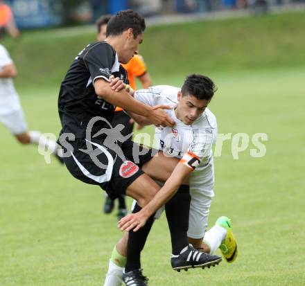 Fussball. Kaerntner Liga. Atus Ferlach gegen Spittal/Drau. Lukas Jaklitsch (Ferlach), Rafael Graf (Spittal). Ferlach, 30.8.2014.
Foto: Kuess
---
pressefotos, pressefotografie, kuess, qs, qspictures, sport, bild, bilder, bilddatenbank