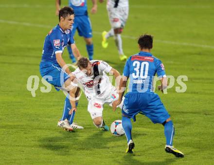 Fussball Bundesliga. RZ Pellets WAC gegen SC Wiener Neustadt. Manuel Kerhe,  (WAC), Christian Deutschmann, Kristijan Dobras (SC Wiener Neustadt). Wolfsberg, am 30.8.2014.
Foto: Kuess

---
pressefotos, pressefotografie, kuess, qs, qspictures, sport, bild, bilder, bilddatenbank