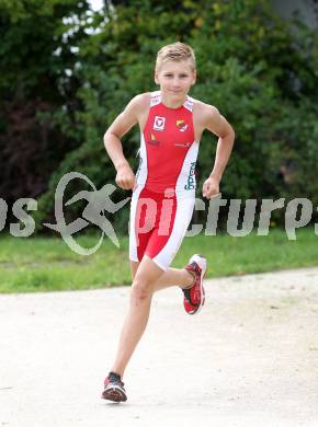 Woerthersee Triathlon.  Rene Hilber. Krumpendorf, am 31.8.2014.
Foto: Kuess
---
pressefotos, pressefotografie, kuess, qs, qspictures, sport, bild, bilder, bilddatenbank