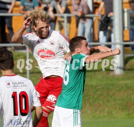 Fussball Unterliga Ost. Ludmannsdorf gegen Mittlern. Dejan Smeh,  (Ludmannsdorf), Philip Lackner (Mittlern). Ludmannsdorf, am 31.8.2014. 
Foto: Kuess
---
pressefotos, pressefotografie, kuess, qs, qspictures, sport, bild, bilder, bilddatenbank