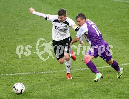 Fussball Regionalliga. SK Austria Klagenfurt gegen SC Sparkasse Weiz. Vedran Vinko,  (Klagenfurt), Lukas Strobl (Weiz). Klagenfurt, 12.9.2014.
Foto: Kuess
---
pressefotos, pressefotografie, kuess, qs, qspictures, sport, bild, bilder, bilddatenbank