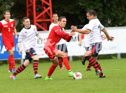 Fussball. Unterliga Ost. KAC 1909 gegen SPG FC Poggersdorf KM. Toni Krijan (KAC), Blaz Brezovacki (Poggersdorf). Klagenfurt, 13.9.2014.
Foto: Kuess
---
pressefotos, pressefotografie, kuess, qs, qspictures, sport, bild, bilder, bilddatenbank