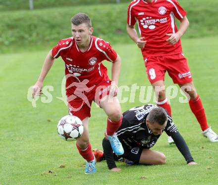 Fussball. Unterliga Ost. Ludmannsdorf gegen Kraig. Miralem Ramic (Ludmannsdorf), Werner Hofmeister (Kraig).
Ludmannsdorf, 14.9.2014.
Foto: Kuess
---
pressefotos, pressefotografie, kuess, qs, qspictures, sport, bild, bilder, bilddatenbank