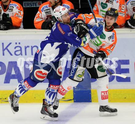 EBEL. Eishockey Bundesliga. EC VSV gegen Moser Medical Graz 99ers.  Eric Hunter, (VSV), Jesse Mathias Jyrkkioe (Graz). Villach, am 19.9.2014.
Foto: Kuess 


---
pressefotos, pressefotografie, kuess, qs, qspictures, sport, bild, bilder, bilddatenbank