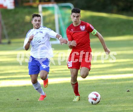 Fussball. Kaerntner Liga. Atus Ferlach gegen Treibach. Lukas Jaklitsch (Ferlach), Yosifov Svetlozar Angelov (Treibach). Ferlach, 28.9.2014.
Foto: Kuess
---
pressefotos, pressefotografie, kuess, qs, qspictures, sport, bild, bilder, bilddatenbank