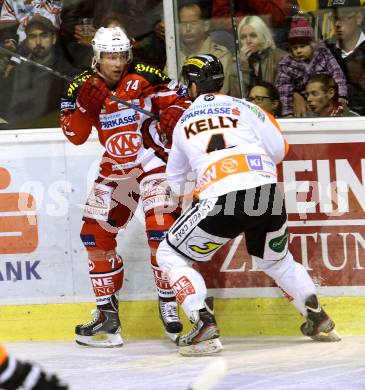 EBEL. Eishockey Bundesliga. KAC gegen Moser Medical Graz 99ers. Jamie Lundmark, (KAC),  Matt Kelly  (Graz). Klagenfurt, am 28.9.2014.
Foto: Kuess 

---
pressefotos, pressefotografie, kuess, qs, qspictures, sport, bild, bilder, bilddatenbank