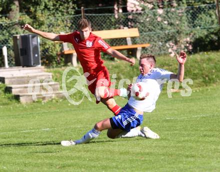 Fussball. Kaerntner Liga. Atus Ferlach gegen Treibach. Daniel Jobst (Ferlach), Stephan Kleedorfer (Treibach). Ferlach, 28.9.2014.
Foto: Kuess
---
pressefotos, pressefotografie, kuess, qs, qspictures, sport, bild, bilder, bilddatenbank