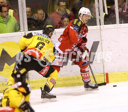 EBEL. Eishockey Bundesliga. KAC gegen UPC Vienna Capitals.  Thomas Hundertpfund, (KAC), Adam Naglich (Caps). Klagenfurt, am 10.10.2014.
Foto: Kuess 

---
pressefotos, pressefotografie, kuess, qs, qspictures, sport, bild, bilder, bilddatenbank