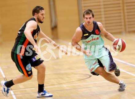 Basketball 2. Bundesliga.  Raiders Villach gegen Basket Flames. Gasper Jeromen, (Villach), Florian Poecksteiner (Basket Flames). Villach, 11.10.2014.
Foto: Kuess
---
pressefotos, pressefotografie, kuess, qs, qspictures, sport, bild, bilder, bilddatenbank