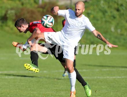 Fussball Kaerntner Liga. Maria Saal gegen Annabichler SV. Rok Smid, (Maria Saal), Stephan Stueckler (ASV). Maria Saal, am 18.10.2014.
Foto: Kuess
---
pressefotos, pressefotografie, kuess, qs, qspictures, sport, bild, bilder, bilddatenbank