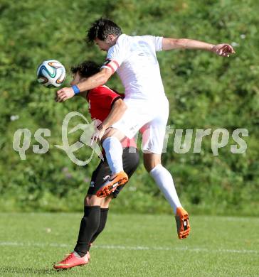 Fussball Kaerntner Liga. Maria Saal gegen Annabichler SV. Zsolt Vari,  (Maria Saal), Almedin Hota (ASV). Maria Saal, am 18.10.2014.
Foto: Kuess
---
pressefotos, pressefotografie, kuess, qs, qspictures, sport, bild, bilder, bilddatenbank