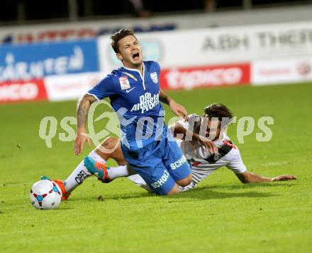 Fussball Bundesliga. RZ Pellets WAC gegen SV Scholz Groedig. Nemanja Rnic,  (WAC), Christoph Martschinko (Groedig). Wolfsberg, am 18.10.2014.
Foto: Kuess

---
pressefotos, pressefotografie, kuess, qs, qspictures, sport, bild, bilder, bilddatenbank