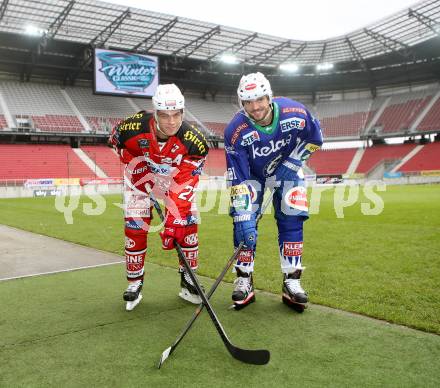 Eishockey. Kaerntner Freiluftderby. KAC gegen VSV. Thomas Hundertpfund (KAC), Benjamin Petrik (VSV). Klagenfurt Woerthersee Stadion. 11.11.2014.
Foto: Kuess 
---
pressefotos, pressefotografie, kuess, qs, qspictures, sport, bild, bilder, bilddatenbank