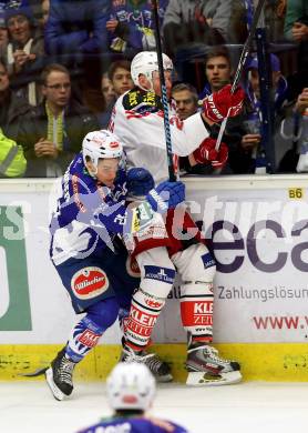 EBEL. Eishockey Bundesliga. EC VSV gegen KAC. Marius Goehringer,  (VSV), Mike Siklenka (KAC). Villach, am 18.1.2015.
Foto: Kuess 


---
pressefotos, pressefotografie, kuess, qs, qspictures, sport, bild, bilder, bilddatenbank