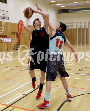 Basketball 2.Bundesliga 2014/15 Play off. Viertelfinale. Raiders Villach gegen Mistelbach Mustangs. Erik Rhinehart, (Villach), Jakob Deimel  (Mistelbach). Villach, am 21.3.2015.
Foto: Kuess
---
pressefotos, pressefotografie, kuess, qs, qspictures, sport, bild, bilder, bilddatenbank