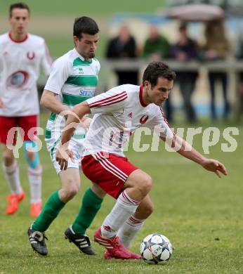 Fussball 1. KLasse A Untere Play Off. Nikolsdorf/Oberdrauburg gegen Obermillstatt. Martin Trutschnig,  (Nikolsdorf), Martin Huber (Obermillstatt). Nikolsdorf,am 11.4.2015.
Foto: Kuess
---
pressefotos, pressefotografie, kuess, qs, qspictures, sport, bild, bilder, bilddatenbank