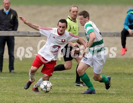 Fussball 1. KLasse A Untere Play Off. Nikolsdorf/Oberdrauburg gegen Obermillstatt. Amer Jukan, (Nikolsdorf), Franz Woelscher  (Obermillstatt). Nikolsdorf,am 11.4.2015.
Foto: Kuess
---
pressefotos, pressefotografie, kuess, qs, qspictures, sport, bild, bilder, bilddatenbank