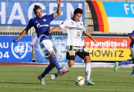 Fussball Testspiel. RZ Pellets WAC gegen Schalke 04. Roland Putsche,  (WAC), Roman Neustaedter (Schalke). Wolfsberg, am 10.7.2015.
Foto: Kuess
---
pressefotos, pressefotografie, kuess, qs, qspictures, sport, bild, bilder, bilddatenbank