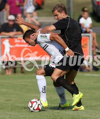 Fussball OEFB Cup. ASKOE Koettmannsdorf gegen RZ Pellets WAC.  Peter Pucker, (Koettmannsdorf), Peter Tschernegg (WAC). Koettmannsdorf, am 19.7.2015.
Foto: Kuess
---
pressefotos, pressefotografie, kuess, qs, qspictures, sport, bild, bilder, bilddatenbank