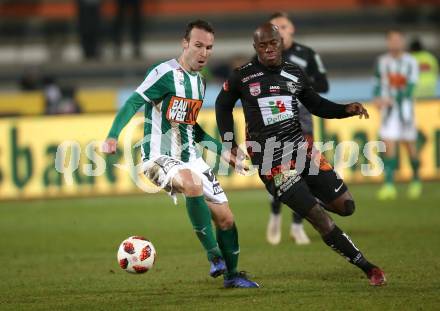 Fussball tipico Bundesliga. RZ Pellets WAC gegen SV Mattersburg. Dever Akeem Orgill,  (WAC), Cesar Ortiz Puentenueva (SV Mattersburg). Wolfsberg, am 24.11.2018.
Foto: Kuess

---
pressefotos, pressefotografie, kuess, qs, qspictures, sport, bild, bilder, bilddatenbank