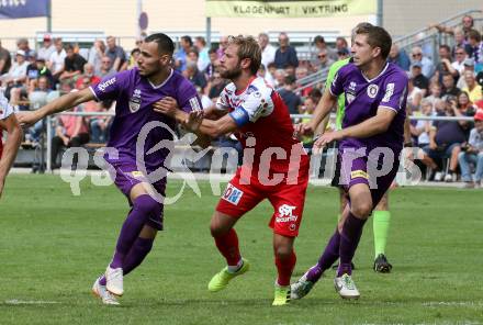 Fussball 2. Liga. SK Austra Klagenfurt gegen FC Blau Weiss Linz. Baris Ekincier, Ivan Saravanja.  (Austria Klagenfurt), Martin Grasegger (Linz). Klagenfurt, am 25.8.2019.
Foto: Kuess
www.qspictures.net
---
pressefotos, pressefotografie, kuess, qs, qspictures, sport, bild, bilder, bilddatenbank