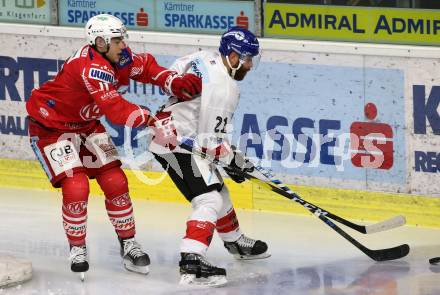 EBEL. Eishockey Bundesliga. KAC gegen	HC TIWAG Innsbruck. Lukas Haudum,  (KAC), Colton Jay Saucerman (Innsbruck). Klagenfurt, am 20.12.2020.
Foto: Kuess
www.qspictures.net

---
pressefotos, pressefotografie, kuess, qs, qspictures, sport, bild, bilder, bilddatenbank