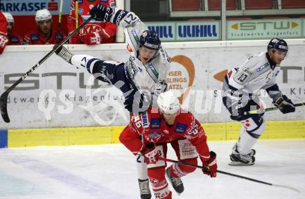 EBEL. Eishockey Bundesliga. KAC gegen	Fehervar AV19. Johannes Bischofberger,  (KAC),  Bence Szabo (Fehervar). Klagenfurt, am 7.3.2021.
Foto: Kuess
www.qspictures.net

---
pressefotos, pressefotografie, kuess, qs, qspictures, sport, bild, bilder, bilddatenbank