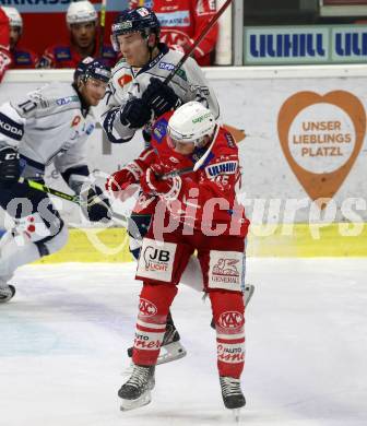 EBEL. Eishockey Bundesliga. KAC gegen	Fehervar AV19. Johannes Bischofberger,  (KAC),  Bence Szabo (Fehervar). Klagenfurt, am 7.3.2021.
Foto: Kuess
www.qspictures.net

---
pressefotos, pressefotografie, kuess, qs, qspictures, sport, bild, bilder, bilddatenbank