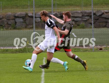 Fussball 1. Klasse B. Kleinkirchheim gegen Velden.   Fabian Kurt Feichter (Kleinkirchheim),  Sebastian Bauer (Velden). Kleinkirchheim, am 25.7.2021.
Foto: Kuess
---
pressefotos, pressefotografie, kuess, qs, qspictures, sport, bild, bilder, bilddatenbank