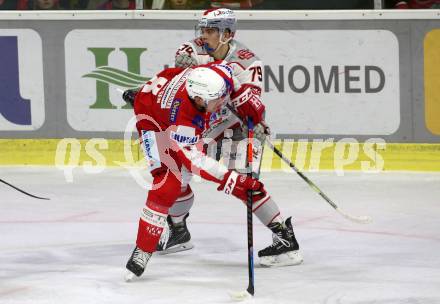 EBEL. Eishockey Bundesliga. KAC gegen	iClinic Bratislava Capitals.  Nicholas ERic Petersen,  (KAC),  Roman Faith (Bratislava). Klagenfurt, am 15.10.2021.
Foto: Kuess
www.qspictures.net

---
pressefotos, pressefotografie, kuess, qs, qspictures, sport, bild, bilder, bilddatenbank