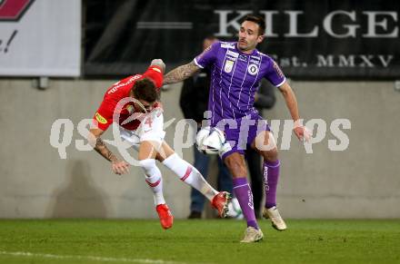 Fussball. Bundesliga. SK Austria Klagenfurt gegen  FC Red Bull Salzburg.   Markus Pink,  (Klagenfurt), Kamil Piatkowski (Salzburg ). Klagenfurt, am 27.11.2021.
Foto: Kuess
www.qspictures.net
---
pressefotos, pressefotografie, kuess, qs, qspictures, sport, bild, bilder, bilddatenbank