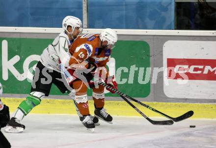 EBEL. Eishockey Bundesliga. KAC gegen	HK SZ Olimpija. Rok Ticar, (KAC),   Mitja Robar  (Olimpija). Klagenfurt, am 7.12.2021.
Foto: Kuess
www.qspictures.net

---
pressefotos, pressefotografie, kuess, qs, qspictures, sport, bild, bilder, bilddatenbank