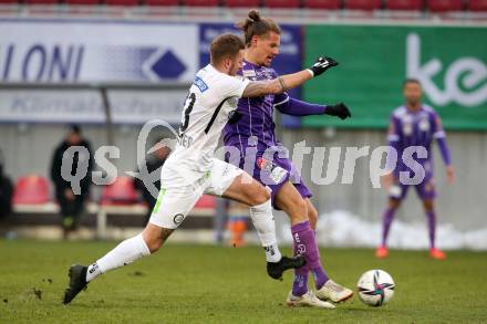 Fussball. Bundesliga. SK Austria Klagenfurt gegen  SK Puntigamer Sturm Graz.  Patrick Greil,  (Klagenfurt), Jakob Jantscher (Graz). Klagenfurt, am 12.12.2021.
Foto: Kuess
www.qspictures.net
---
pressefotos, pressefotografie, kuess, qs, qspictures, sport, bild, bilder, bilddatenbank