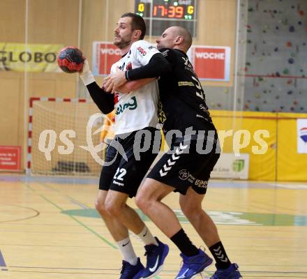 Handball. SC Ferlach gegen Baernbach/Koeflach.  Dean Pomorisac, (SCF),  Milos Djurdjevic  (Baernbach/Koeflach). Ferlach, am 18.12.2021.
Foto: Kuess
---
pressefotos, pressefotografie, kuess, qs, qspictures, sport, bild, bilder, bilddatenbank