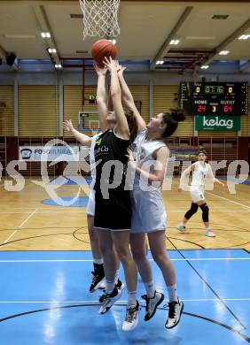 Basketball Damen Superliga 2021/2022. Grunddurchgang 9. Runde.  KOS Celovec Damen gegen  Basket Flames. Sasa Tomazic  (KOS), Lara Brunner   (Basket Flames). Klagenfurt, am 22.1.2022.
Foto: Kuess
www.qspictures.net
---
pressefotos, pressefotografie, kuess, qs, qspictures, sport, bild, bilder, bilddatenbank