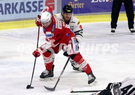 EBEL. Eishockey Bundesliga. KAC gegen	Dornbirn Bulldogs. Rok Ticar(KAC), Matthew Spencer (Dornbirn Bulldogs). Klagenfurt, am 28.1.2022.
Foto: Kuess
www.qspictures.net

---
pressefotos, pressefotografie, kuess, qs, qspictures, sport, bild, bilder, bilddatenbank