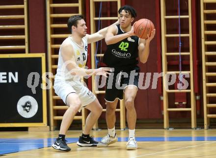 Basketball Zweite Liga 2021/2022. Grunddurchgang 14. Runde.  Woerthersee Piraten gegen Basket Flames.  Jan-Arne Apschner (Piraten),  Yann Grandperret (Basket Flames). Klagenfurt, am 29.1.2022. 
Foto: Kuess
www.qspictures.net

---
pressefotos, pressefotografie, kuess, qs, qspictures, sport, bild, bilder, bilddatenbank