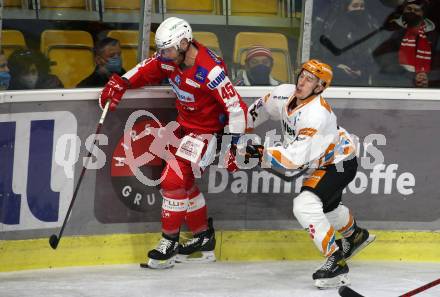 EBEL. Eishockey Bundesliga. KAC gegen	Steinbach Black Wings Linz. Andrej Tavzelj, (KAC), Jakob Mitsch   (Linz). Klagenfurt, am 8.2.2022.
Foto: Kuess
www.qspictures.net

---
pressefotos, pressefotografie, kuess, qs, qspictures, sport, bild, bilder, bilddatenbank